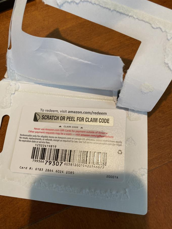 Peeling a Scratch off for claim code from an  gift card